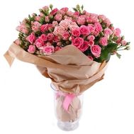 Bouquet of bush roses in kraft paper