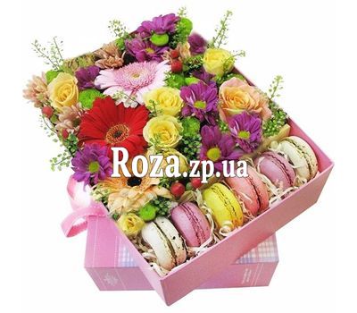 Composition from flowers and macaroons Composition from flowers and macaroons
