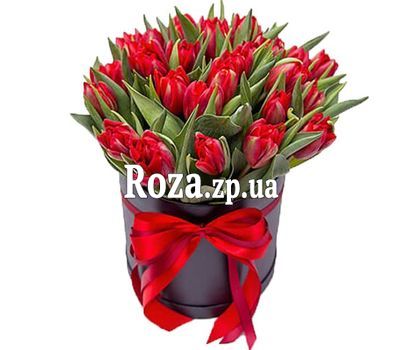 Red tulips in a hat box Red tulips in a hat box
