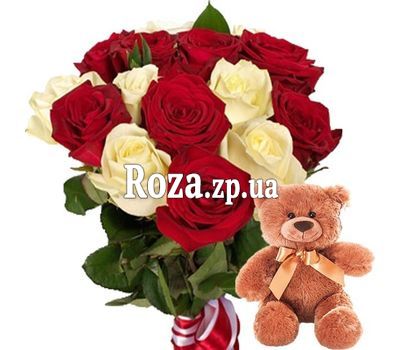 Teddy bear with bouquet of roses